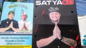 Foto: Baliho Gus Bota (kanan) dan Paslon Wasudewa (kiri) di titik lampu merah Jl. sunset Road, Seminyak. Sumber: Yulius N/wacanabali.com